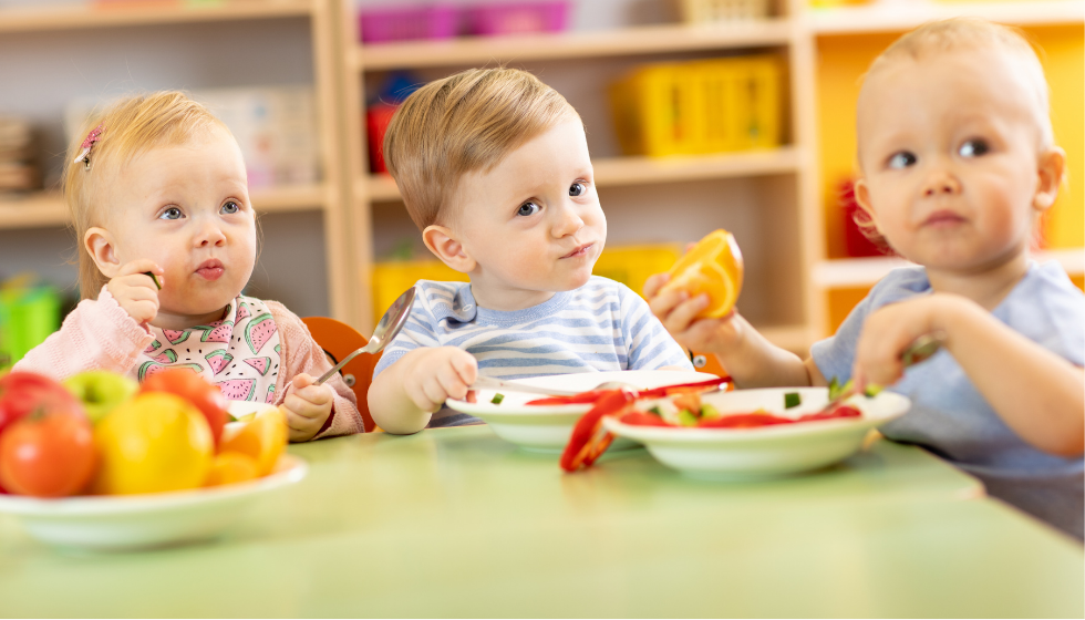 Several young children eating together